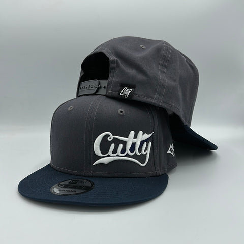 Snapback - Classic Script in WHITE/NAVY Puff on “CHARCOAL/NAVY”