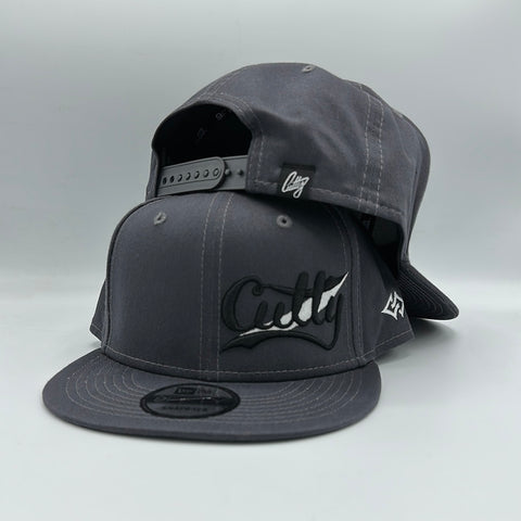 Snapback - Classic Script in WHITE/BLACK Puff on “CHARCOAL”